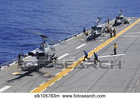 AH-1Z Super Cobra helicopters land aboard USS Essex. View Large Photo Image Picture - AH-1Z Super Cobra helicopters land aboard USS Essex.. Fotosearch