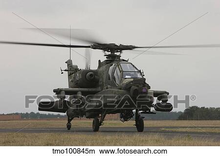 AH-64 Apache helicopter on the runway. View Large Photo Image Picture - AH-64 Apache helicopter on the runway.. Fotosearch