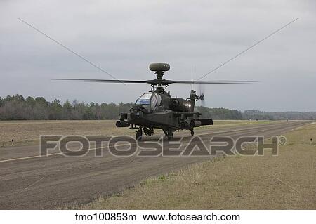 Picture - AH-64 Apache helicopter on the runway.. Fotosearch