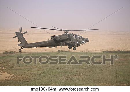 AH-64D Apache helicopter on a mission over Northern Iraq. View Large Photo Image Picture - AH-64D Apache helicopter on a mission over Northern Iraq.. Fotosearch
