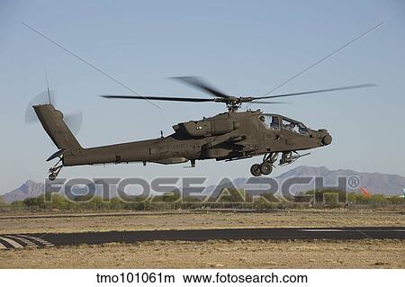 Picture - AH-64D Apache Longbow lifts off on a mission.. Fotosearch