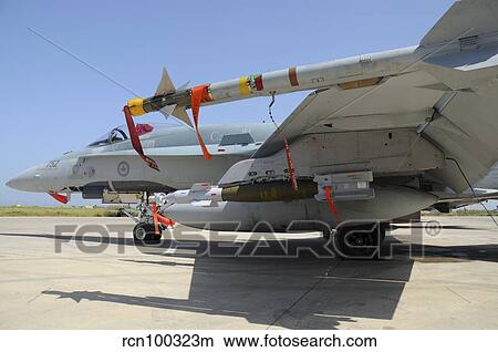 AIM-9L Sidewinder missile and GBU-12 Laser-Guided Bomb loaded on a CF-18 Hornet. View Large Photo Image Picture - AIM-9L Sidewinder missile and GBU-12 Laser-Guided Bomb loaded on a CF-18 Hornet.. Fotosearch