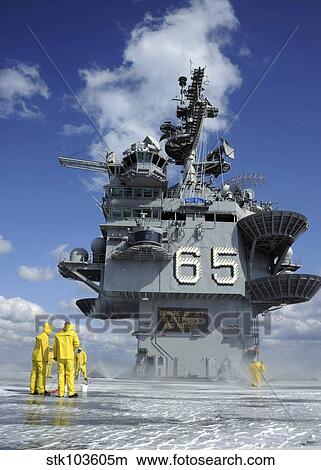 Air department Sailors test the sprinkler system on the flight deck of the USS Enterprise. View Large Photo Image Picture - Air department Sailors test the sprinkler system on the flight deck of the USS Enterprise.. Fotosearch