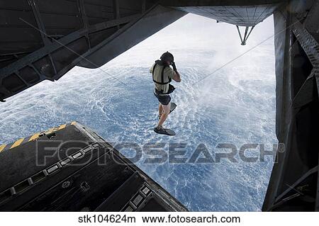 Picture - Air Force pararescueman jumps from a CH-53E Super Stallion helicopter.. Fotosearch