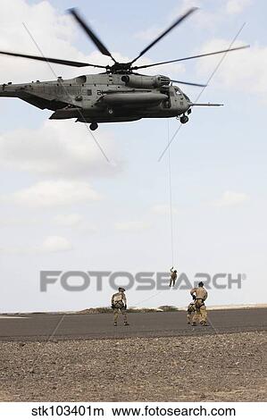 Air Force pararescuemen conduct a combat insertion and extraction exercise in Djibouti, Africa. View Large Photo Image Picture - Air Force pararescuemen conduct a combat insertion and extraction exercise in Djibouti, Africa.. Fotosearch