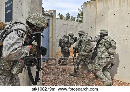 Air Force Reserve security forces members raid an enemy compound. View Large Photo Image Picture - Air Force Reserve security forces members raid an enemy compound.. Fotosearch