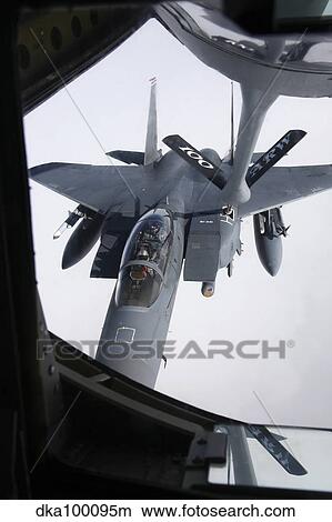 Air refueling a F-15E Strike Eagle of the U. S. Air Force. View Large Photo Image Picture - Air refueling a F-15E Strike Eagle of the U. S. Air Force.. Fotosearch