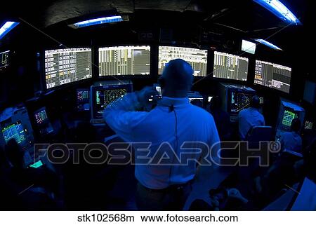 Air Traffic Controller watches as a flight cycle begins. View Large Photo Image Picture - Air Traffic Controller watches as a flight cycle begins.. Fotosearch