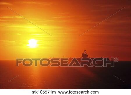Aircraft carrier USS Enterprise underway in the Atlantic Ocean during sunset. View Large Photo Image Picture - Aircraft carrier USS Enterprise underway in the Atlantic Ocean during sunset.. Fotosearch