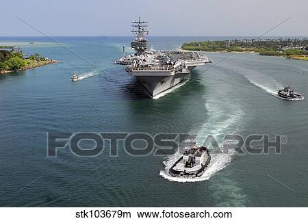 Aircraft carrier USS Ronald Reagan transits Pearl Harbor into Hawaii. View Large Photo Image Picture - Aircraft carrier USS Ronald Reagan transits Pearl Harbor into Hawaii.. Fotosearch