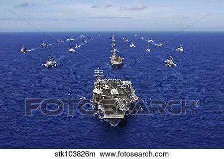 Picture - Aircraft carrier USS Ronald Reagan transits the Pacific Ocean with a fleet of ships.. Fotosearch