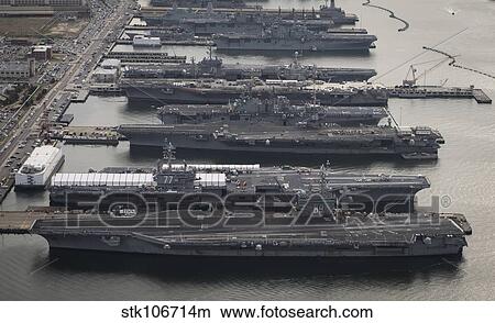 Aircraft carriers in port at Naval Station Norfolk, Virginia. View Large Photo Image Picture - Aircraft carriers in port at Naval Station Norfolk, Virginia.. Fotosearch