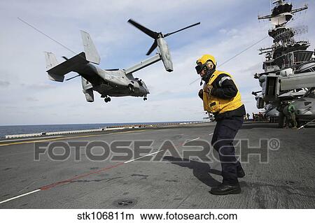 Airman from the Royal Navy stands on the flight deck of USS Kearsarge. View Large Photo Image Picture - Airman from the Royal Navy stands on the flight deck of USS Kearsarge.. Fotosearch