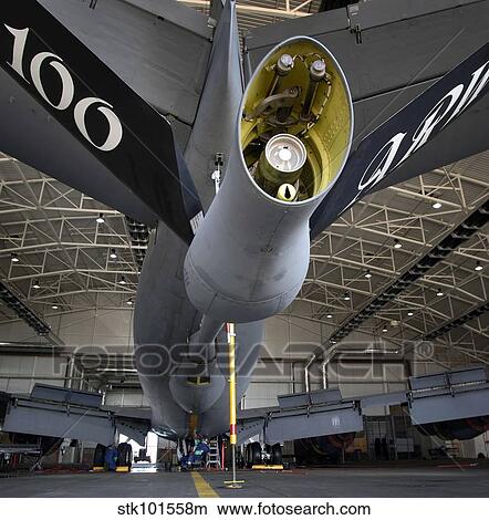 Picture - Airman hand-washes the centerline on the underbelly of a KC-135 Stratotanker.. Fotosearch