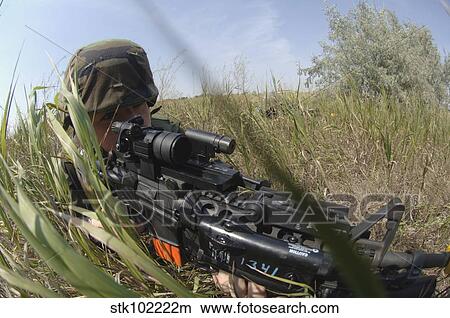 Airman makes a tactical move during a coordinated security training exercise. View Large Photo Image Picture - Airman makes a tactical move during a coordinated security training exercise.. Fotosearch