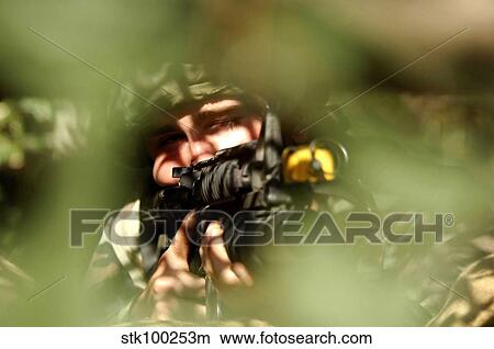 Airman provides cover fire. View Large Photo Image Picture - Airman provides cover fire.. Fotosearch