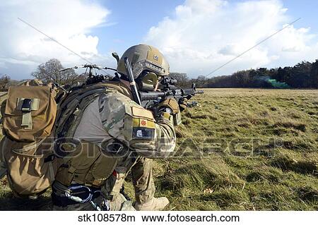 Airman sets up a perimeter defense at the Stanford Training Area, England. View Large Photo Image Picture - Airman sets up a perimeter defense at the Stanford Training Area, England.. Fotosearch