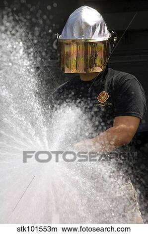 Picture - Airman tests a water pump truck.. Fotosearch