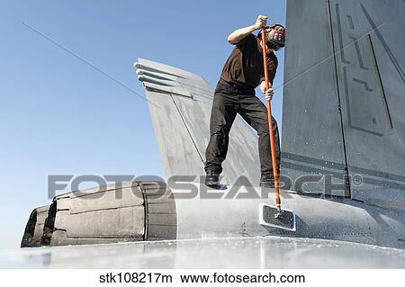 Airman washes an F/A-18F Super Hornet. View Large Photo Image Picture - Airman washes an F/A-18F Super Hornet.. Fotosearch