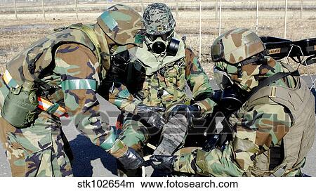 Airmen assist a Republic of Korea Army soldier with decontamination of his gears. View Large Photo Image Picture - Airmen assist a Republic of Korea Army soldier with decontamination of his gears.. Fotosearch