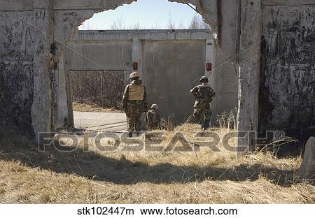 Picture - Airmen find a designated location during a land navigation exercise.. Fotosearch