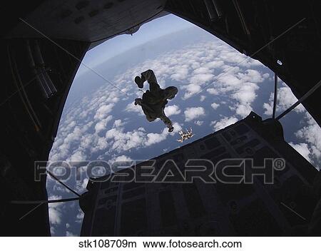 Airmen jump out of an HC-130 Hercules over Djibouti. View Large Photo Image Picture - Airmen jump out of an HC-130 Hercules over Djibouti.. Fotosearch