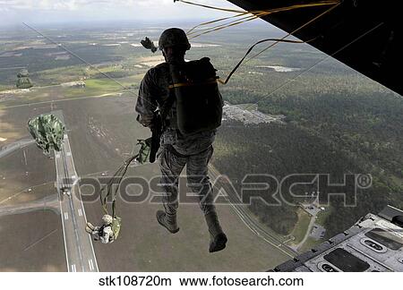 Airmen jump out of an HC-130P/N Combat King over Geogia. View Large Photo Image Picture - Airmen jump out of an HC-130P/N Combat King over Geogia.. Fotosearch