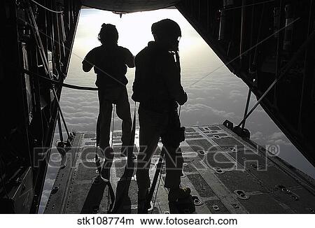 Airmen prepare for a HALO jump aboard an HC-130 over Djibouti. View Large Photo Image Picture - Airmen prepare for a HALO jump aboard an HC-130 over Djibouti.. Fotosearch