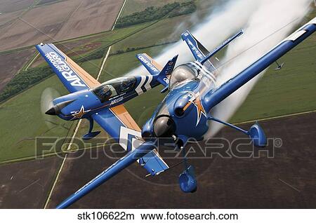 Picture - Airplanes perform at the Sound of Speed Airshow in Missouri.. Fotosearch