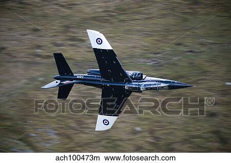 Alpha Jet of the Royal Air Force low level flying over North Wales. View Large Photo Image Picture - Alpha Jet of the Royal Air Force low level flying over North Wales.. Fotosearch