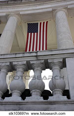 Picture - American Flags hang in the Amphitheatre at Arlington National Cemetery, Virginia.. Fotosearch