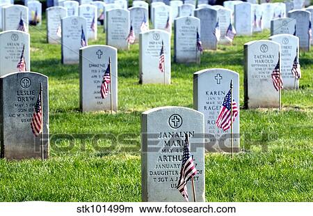 American flags placed in the front of headstones at Arlington National Cemetery. View Large Photo Image Picture - American flags placed in the front of headstones at Arlington National Cemetery.. Fotosearch