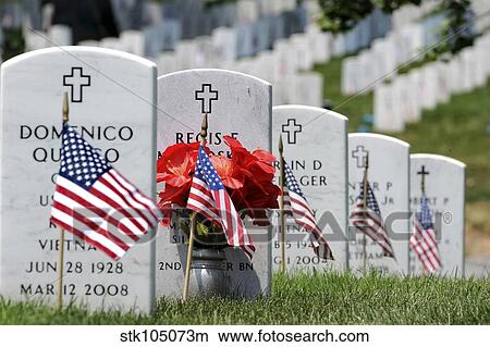 American flags placed in the front of headstones at Arlington National Cemetery. View Large Photo Image Picture - American flags placed in the front of headstones at Arlington National Cemetery.. Fotosearch