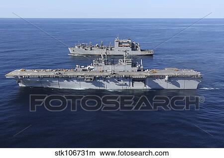 Amphibious assault ship USS Kearsarge alongside USNS Robert E. Peary. View Large Photo Image Picture - Amphibious assault ship USS Kearsarge alongside USNS Robert E. Peary.. Fotosearch