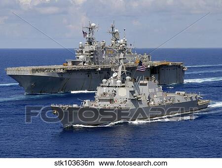 Amphibious assault ship USS Nassau and guided missile destroyer USS Bulkeley transit the Atlantic Ocean. View Large Photo Image Picture - Amphibious assault ship USS Nassau and guided missile destroyer USS Bulkeley transit the Atlantic Ocean.. Fotosearch