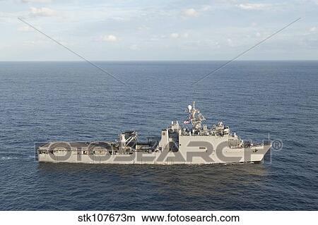Amphibious dock landing ship USS Pearl Harbor transits the Pacific Ocean. View Large Photo Image Picture - Amphibious dock landing ship USS Pearl Harbor transits the Pacific Ocean.. Fotosearch