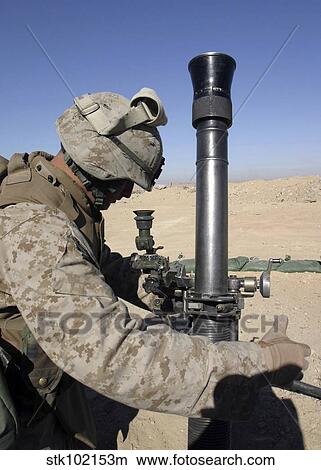 An 81mm mortarman adjusts the mortar sights during a fire mission. View Large Photo Image Picture - An 81mm mortarman adjusts the mortar sights during a fire mission.. Fotosearch