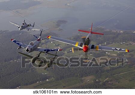 An A-10 Thunderbolt, F-86 Sabre, P-38 Lightning and P-51 Mustang in flight. View Large Photo Image Picture - An A-10 Thunderbolt, F-86 Sabre, P-38 Lightning and P-51 Mustang in flight.. Fotosearch