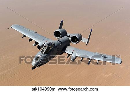 An A-10 Thunderbolt II over the skies of Afghanistan. View Large Photo Image Picture - An A-10 Thunderbolt II over the skies of Afghanistan.. Fotosearch