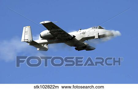 Picture - An A-10 Thunderbolt II pilot fires the plane's 30-mm cannon.. Fotosearch
