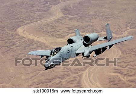 Picture - An A-10 Thunderbolt soars above the skies of Iraq.. Fotosearch