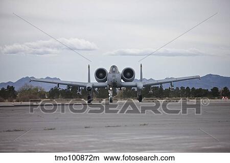An A-10 Thunderbolt taxis to the runway at Nellis Air Force Base, Nevada. View Large Photo Image Picture - An A-10 Thunderbolt taxis to the runway at Nellis Air Force Base, Nevada.. Fotosearch