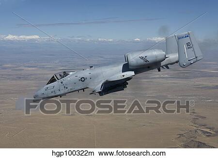 An A-10C Thunderbolt fires its 30mm cannon. View Large Photo Image Picture - An A-10C Thunderbolt fires its 30mm cannon.. Fotosearch