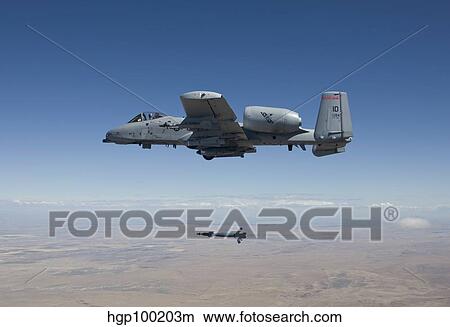Picture - An A-10C Thunderbolt releases a GBU-12 laser guided bomb.. Fotosearch
