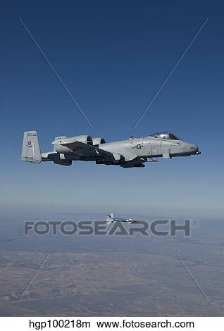 An A-10C Thunderbolt releases a GBU-12 laser guided bomb. View Large Photo Image Picture - An A-10C Thunderbolt releases a GBU-12 laser guided bomb.. Fotosearch
