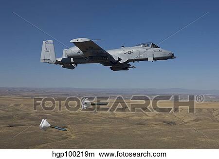 An A-10C Thunderbolt releases two High Drag BDU-50's over Idaho. View Large Photo Image Picture - An A-10C Thunderbolt releases two High Drag BDU-50's over Idaho.. Fotosearch