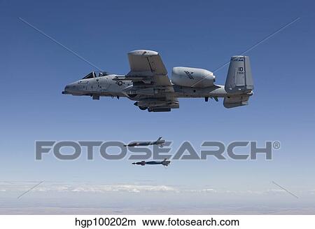 An A-10C Thunderbolt releases two GBU-12 laser guided bombs. View Large Photo Image Picture - An A-10C Thunderbolt releases two GBU-12 laser guided bombs.. Fotosearch