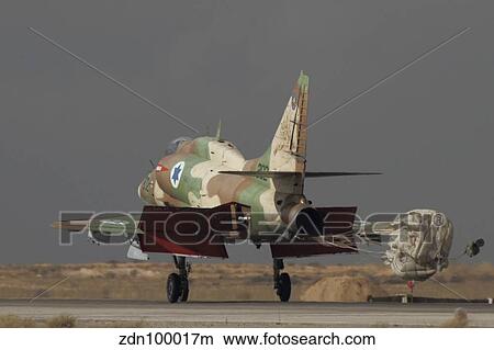 An A-4N Ayit of the Israeli Air Force deploys its drag chute on the runway. View Large Photo Image Picture - An A-4N Ayit of the Israeli Air Force deploys its drag chute on the runway.. Fotosearch