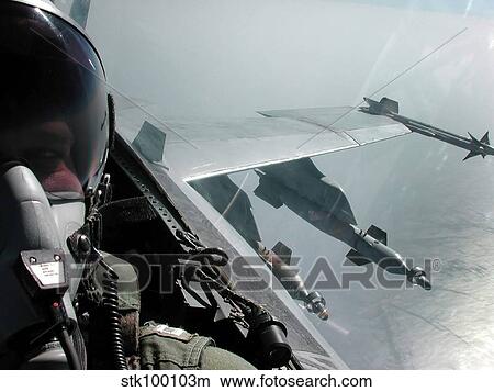 Picture - An aerial cockpit camera view onboard a F/A-18C Hornet aircraft.. Fotosearch