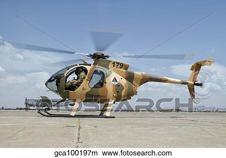 Picture - An Afghan Air Force MD-530F helicopter at Shindand Air Base.. Fotosearch
